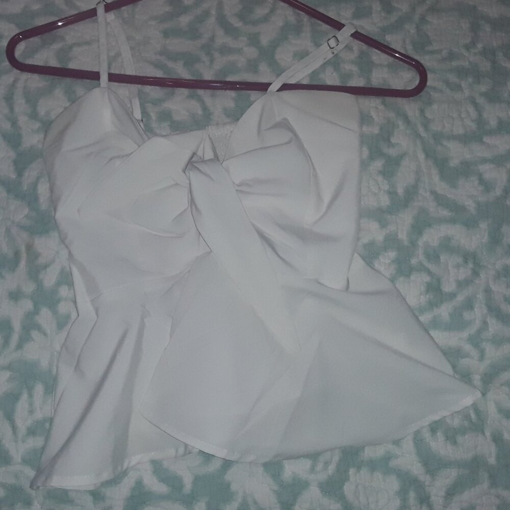 Spaghetti straps, white front tie closure white halter top.  (No Brand Name)